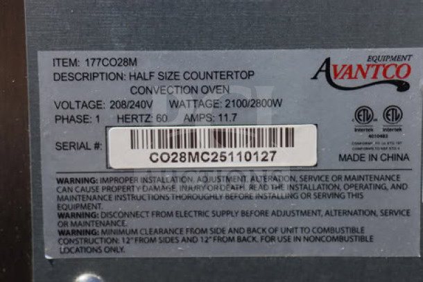 Alt Text: "Label for Avantco CO-28M half-size countertop convection oven, showing model, voltage, wattage, and serial number CO28MC25110127."