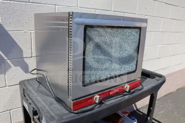 Brand new Avantco CO-28M countertop convection oven, 2.3 cu. ft., visible scratch on glass, 208/240V, 2100/2800W.