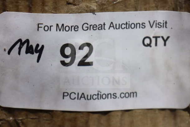 Sticker label on brown cardboard with text: "For More Great Auctions Visit PCIAuctions.com." Handwritten "May 92 QTY" visible.