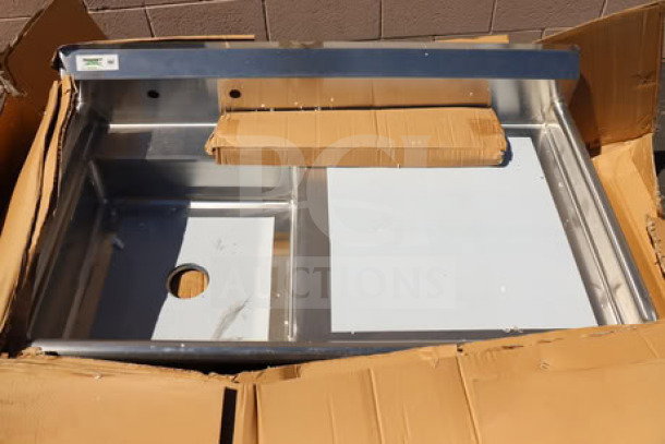 BRAND NEW Regency 50" stainless steel dishtable, model 600UDT50L, sink on left, 16-gauge. Box damaged.