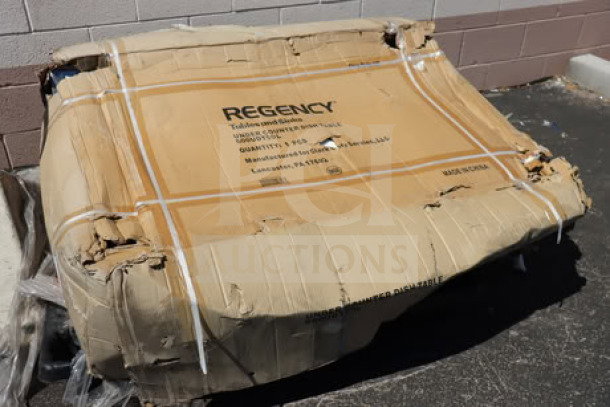 Brand new Regency 50" 16-gauge stainless steel dishtable, model 600UDT50L, with sink on left. Box is damaged.