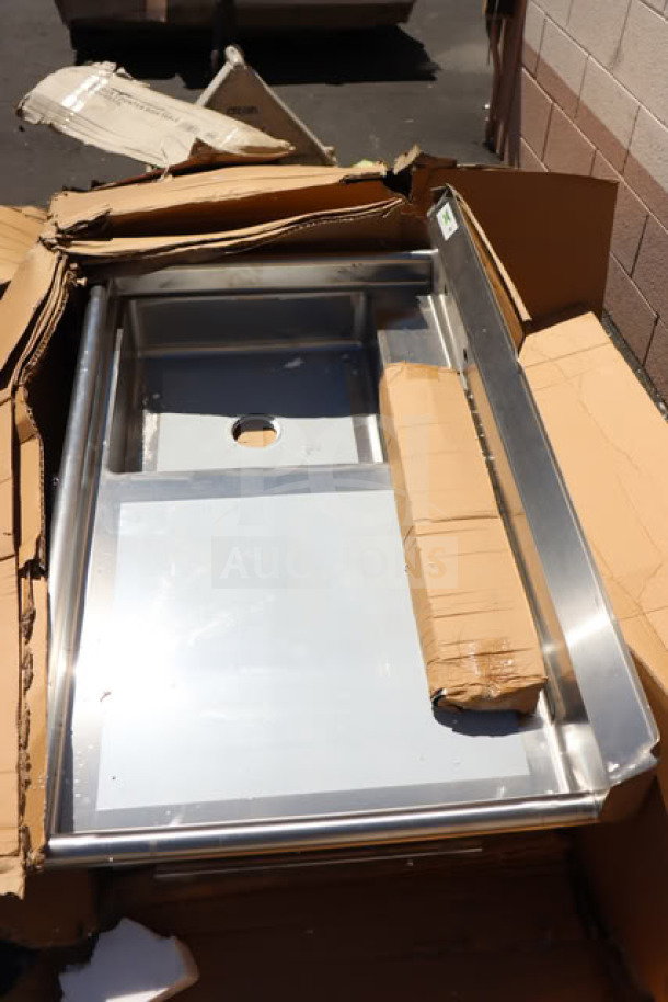 Regency 50" 16-gauge stainless steel undercounter dishtable with left sink, model 600UDT50L. Box damaged.