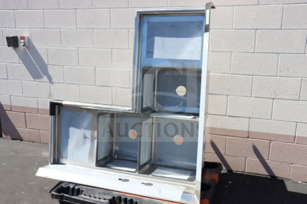 Regency 600S31620C three compartment corner sink, two 18" drainboards, brand new scratch-n-dent condition, stainless steel.