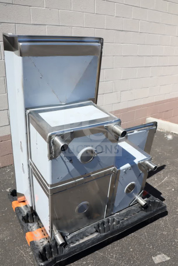 Brand new Regency 600S31620C corner sink with three compartments, two 18" drainboards, visible dents, stainless steel.