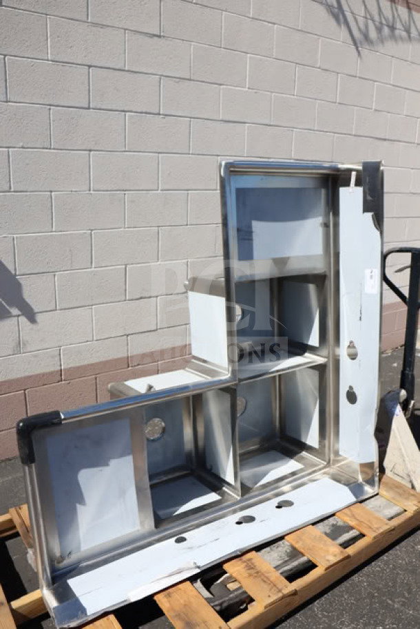 Regency 600S31620C 57" three-compartment corner sink with two 18" drainboards, minor scratches and dents visible.