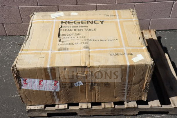 Brand new Regency 16 Gauge 2' Clean Dish Table in box. Model 600CDT24L, left drainboard. Box shows shipping labels and wear.