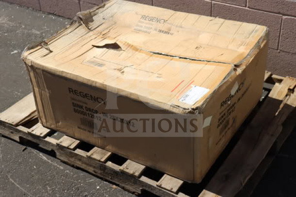 Regency stainless steel drop-in sink, 28"x20"x12", model 600DI12812, in original packaging on a wooden pallet.