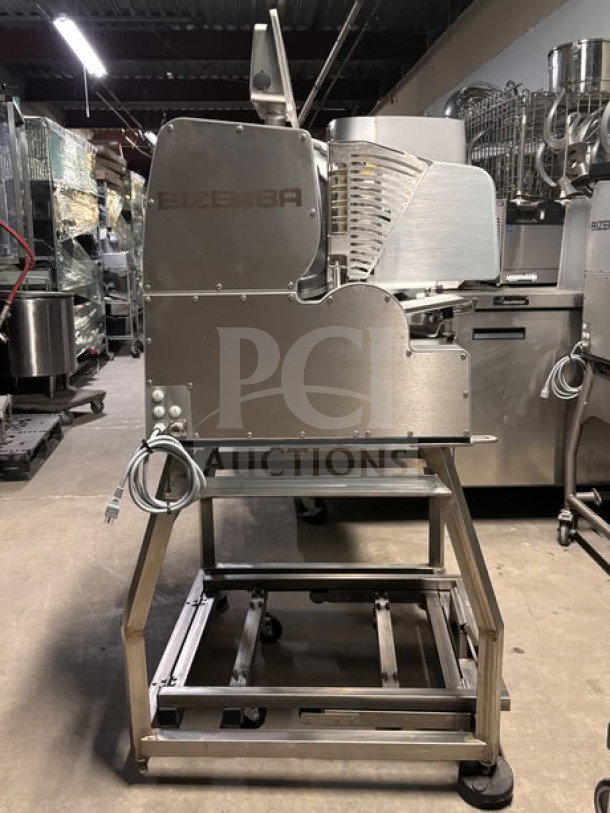 Bizerba VSI330 F W electric meat slicer, 13” blade, touchscreen controls, on stainless steel mobile stand with casters.