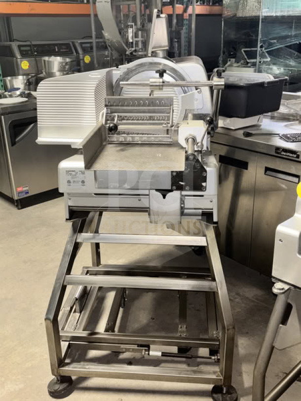 Bizerba VSI330 F W electric meat slicer with 13” blade, touchscreen, IPX5 washdown. Includes stainless steel stand with casters.