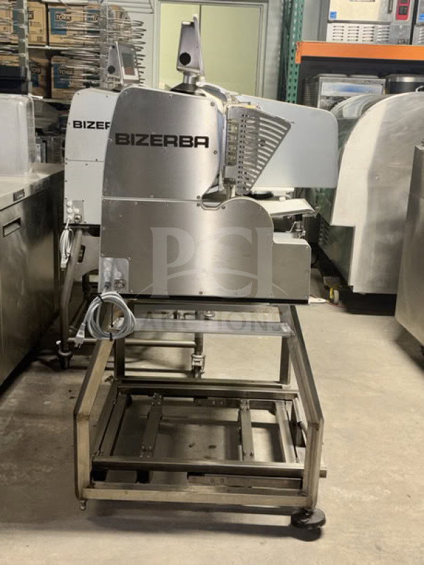 Electric Bizerba VSI330 F W Meat Slicer, 13” blade, touchscreen controls, on stainless steel mobile stand with casters.