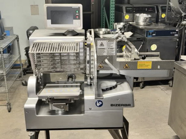 Bizerba VSI330 F W electric meat slicer, 13" blade, fully automatic, touchscreen, portion scale, on stainless steel stand.