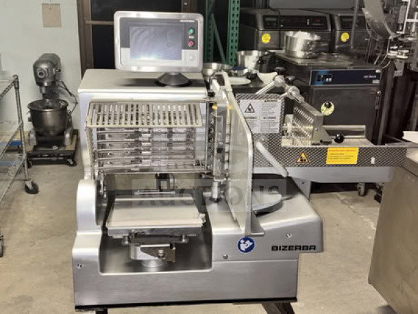 Bizerba VSI330 F W electric meat slicer with 13” blade, touchscreen, and portion scale on stainless steel stand.