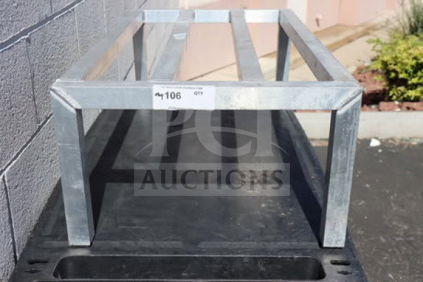 Brand new New Age 6004 aluminum dunnage rack, 36"x20"x12", 2,000 lb. capacity, out of box, visible label marked "106 Qty".
