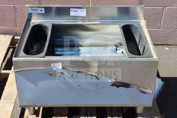 Regency 21" x 30" underbar ice bin, model 600IB2130C0, with scratches and dents, features 10 circuit post-mix cold plate and bottle holders, 65 lb. capacity.