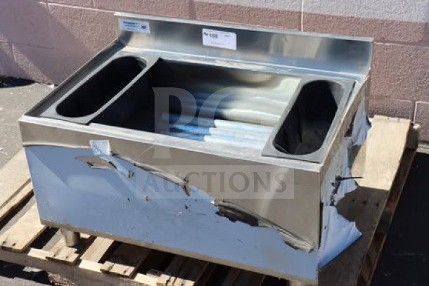 Regency 21" x 30" underbar ice bin with cold plate, two bottle holders, and visible scratches on metal exterior. Model 600IB2130C0.