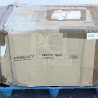 Regency 600GT35 grease trap in original box, 70 lb. capacity, 35 GPM, PDI certified, non-threaded connections, visible wear on box.