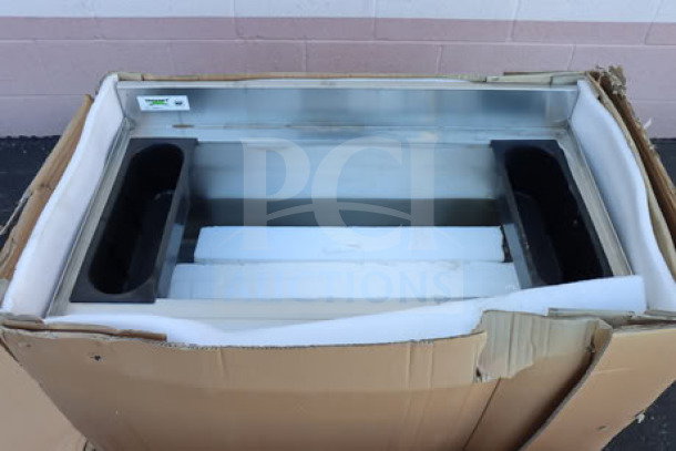 Regency 600IB2136 stainless steel underbar ice bin, 21"x36", with bottle holders in ripped packaging. Brand new condition.