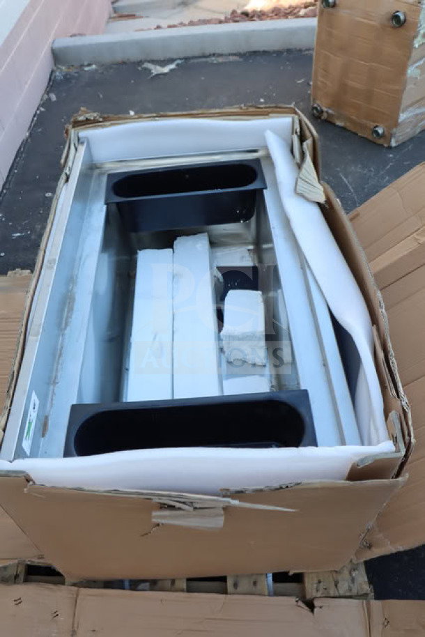 Brand new Regency 600IB2136 stainless steel underbar ice bin with bottle holders, 21"x36", 119 lb. Ripped packaging.