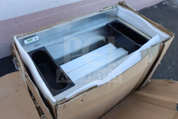 Regency 600IB2136 stainless steel underbar ice bin, 21"x36", with bottle holders, new condition, packaging ripped.