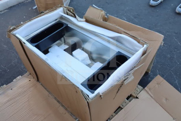 Regency 600IB2136 stainless steel underbar ice bin with bottle holders. Packaging ripped. Brand new condition.