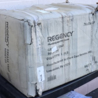 Regency grease trap model 600GT25 in damaged original packaging, 50 lb. capacity, 25 GPM, 3" non-threaded connections.