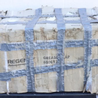 Regency 600GT20 40 lb. grease trap with damaged packaging, secured with duct tape. PDI certified, visible label.