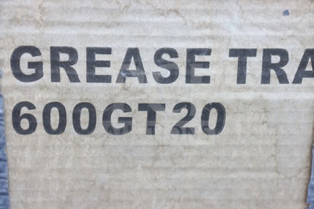 Regency 600GT20 40 lb. grease trap, PDI certified, in damaged packaging with duct tape. Non-threaded connections.