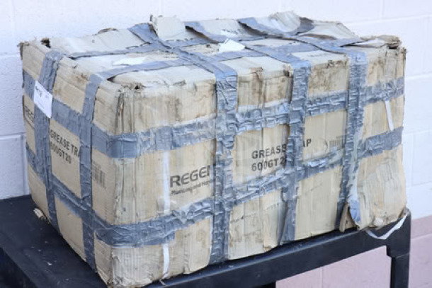 Brand new Regency 600GT20 40 lb. grease trap, 20 GPM, PDI certified, boxed with duct-taped packaging, non-threaded connections.