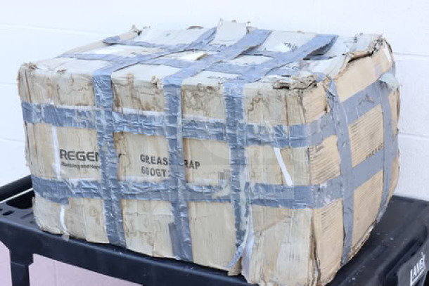 Regency 600GT20 40 lb. 20 GPM grease trap in damaged packaging sealed with duct tape, PDI certified.