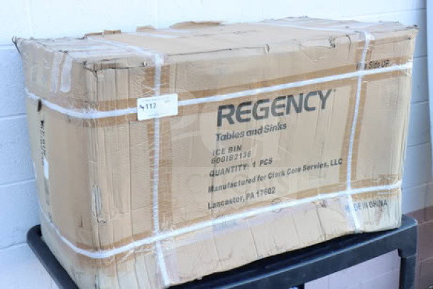 Brand new Regency 6001B2136 stainless steel underbar ice bin in original, slightly damaged packaging. Features 21" x 36" size, bottle holders, 119 lb capacity.
