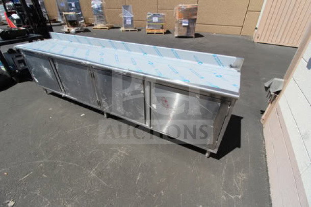 Eagle Group 24"x120" stainless steel work table with cabinet base, model CBH24120SE-BS, 4.5" backsplash, scratch-n-dent.