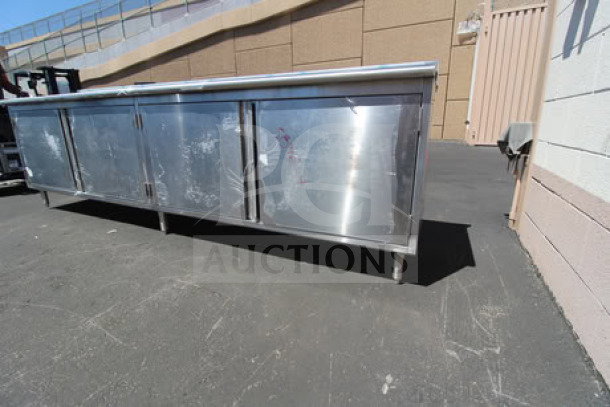 Brand new Eagle Group CBH24120SE-BS 24"x120" work table with cabinet base, stainless steel, minor scratches, 4.5" backsplash.
