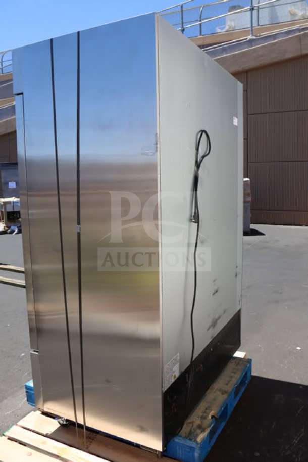 Brand new Avantco A-49F-HC 54" solid door reach-in freezer on pallet, 115V, 8.5A, minor scratches visible.