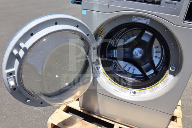 Brand new Crossover 27" front load electric washer, model WHLFP817C2OPL, 3.5 cu. ft., 120V, scratches visible.