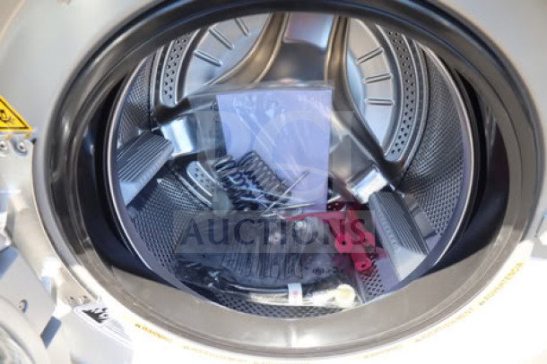 Crossover WHLFP817C2OPL 3.5 cu. ft. front load commercial washer interior view, showing drum and accessories. Brand new.