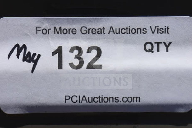 "Label with auction details: 'May 132 QTY' and 'PCIAuctions.com' for a Crossover commercial washer"