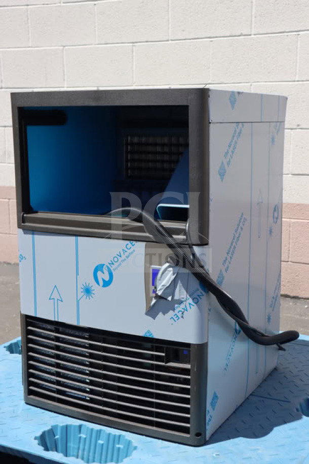 Manitowoc UDP-0080A-161 undercounter ice machine, scratch-n-dent, air-cooled, 110 lb capacity, new condition, tags visible.