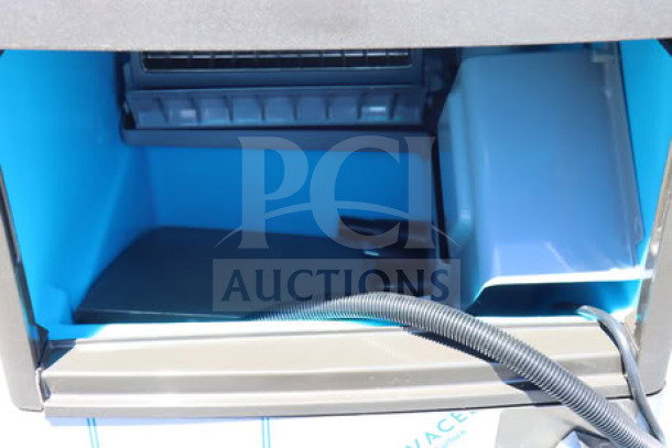 Manitowoc UDP-0080A-161 undercounter ice machine interior, new, with 31 lb. bin. Sliding door shown, 115V, 110 lb. capacity.