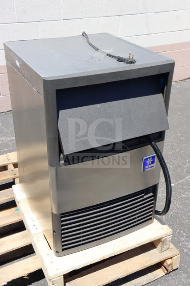 BRAND NEW SCRATCH-N-DENT Manitowoc UDP-0080A ice machine with 31 lb. bin on pallet, model details visible.