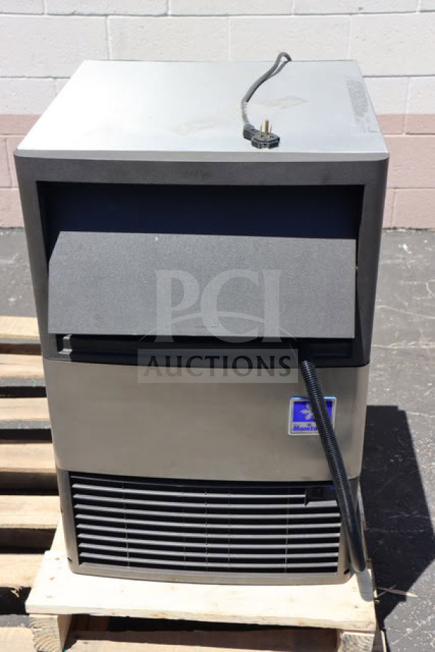 Brand new Manitowoc UDP-0080A undercounter ice machine with 31 lb bin, 115V, 110 lb capacity, displayed on a pallet.