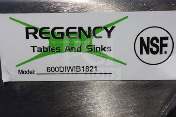 Brand new Regency 600DIWIB1821 stainless steel water station with ice bin; minor scratches; NSF certified label visible.