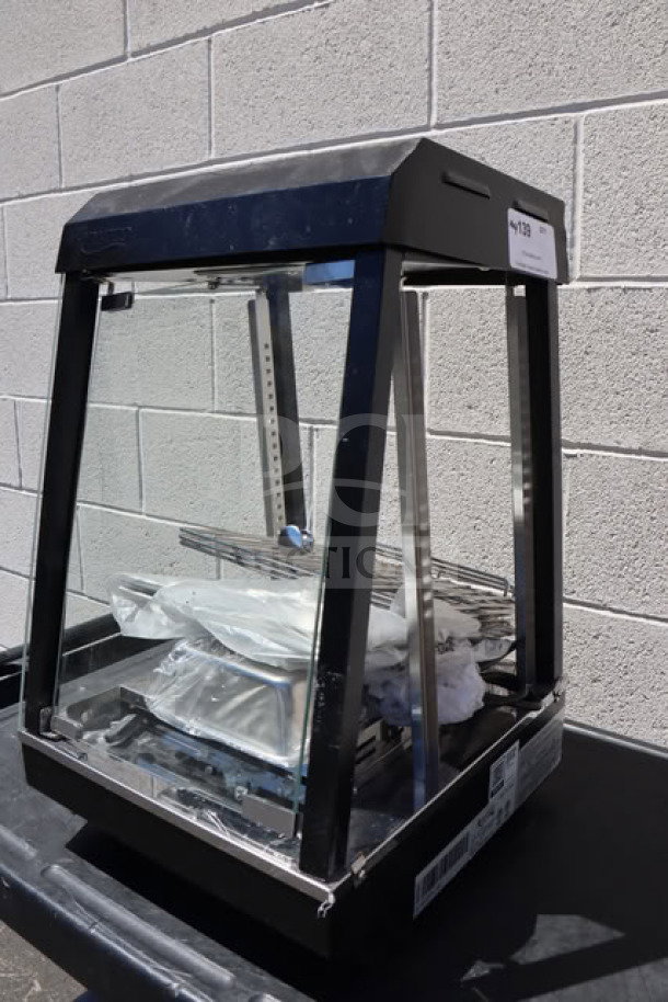 Brand new Avantco HDC-13 heated display case with hinged doors, 3 shelves, 15" wide, 120V, 850W, slight scratches.