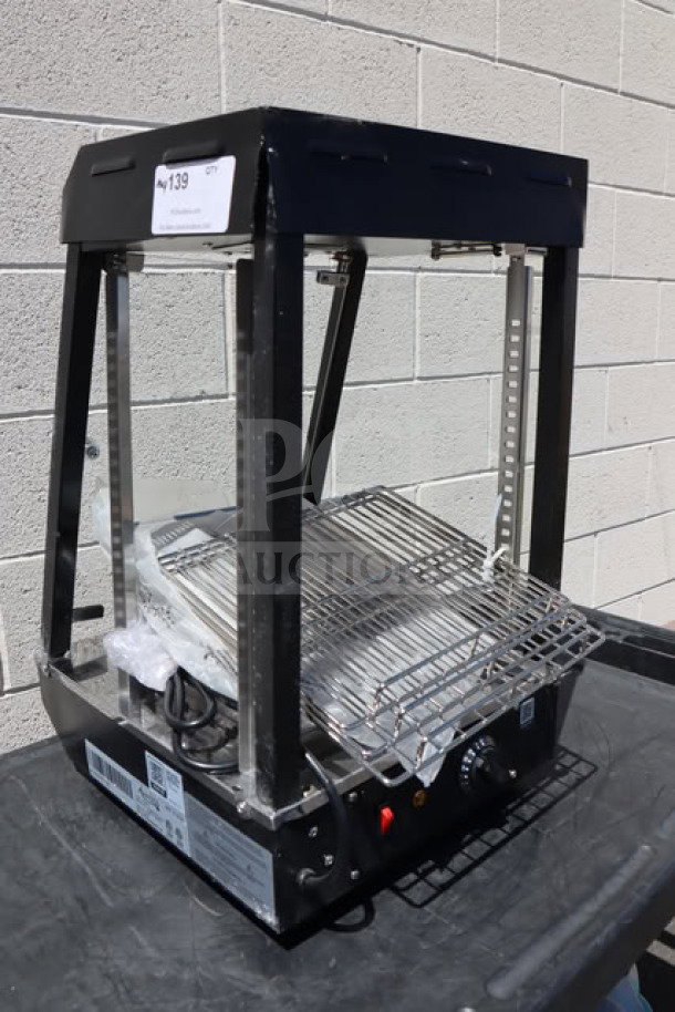Avantco HDC-13 countertop heated display case, brand new, three shelves, hinged doors, 120V, 850W, minor scratches visible.