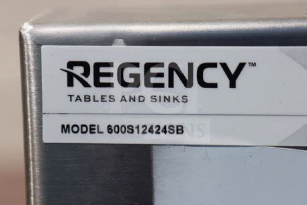 Regency 600S12424SB commercial utility sink, 24" x 24" x 13" bowl. Brand new with scratches and dents. Model label visible.