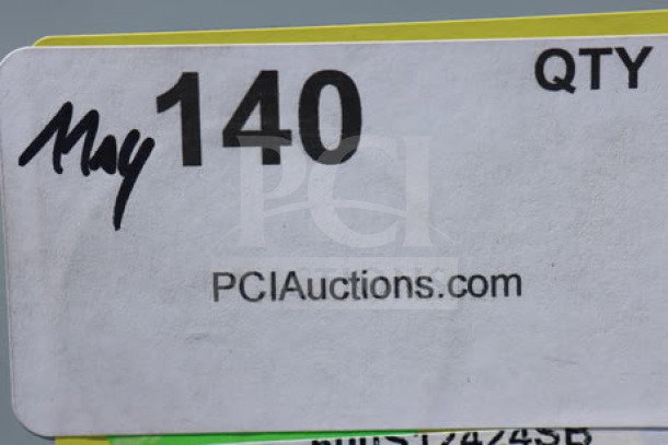 "PCI Auctions label with item number 140 and URL, indicating auction listing for Regency 600S12424SB utility sink."