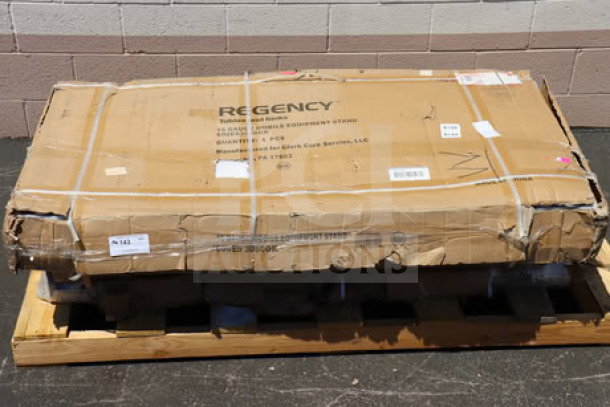 Brand new Regency 600ES3060GK 30" x 60" stainless steel equipment stand with galvanized undershelf, original packaging damaged.