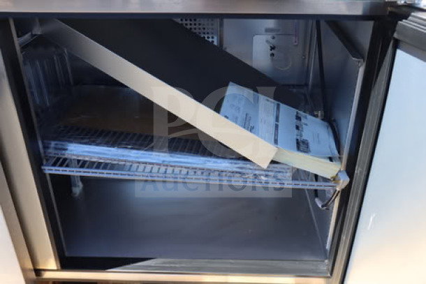 True TSSU-60-16-HC refrigerated sandwich prep table, 2 doors, 115V, 6.5A, scratch-n-dent, powered and tested, S/N: 11235146.