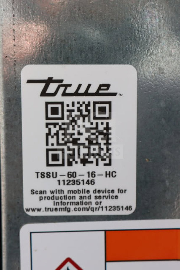 Alt text: QR code label on True TSSU-60-16-HC Refrigerated Sandwich Prep Table indicating model and serial number 11235146.
