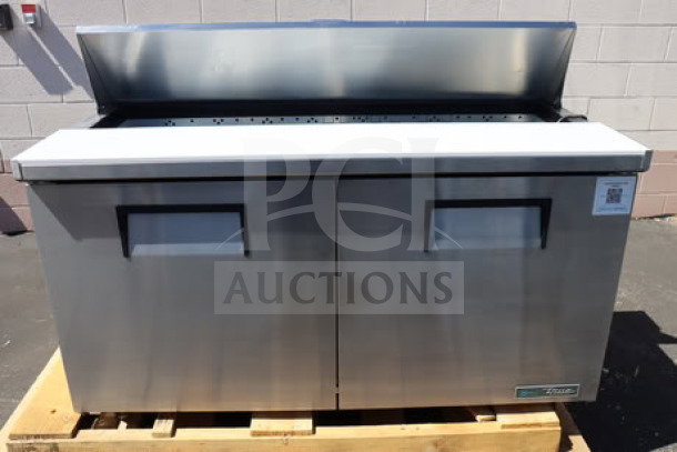Brand new True TSSU-60-16-HC refrigerated sandwich prep table, stainless steel, 60 3/8", 2-door, tested, powered on.