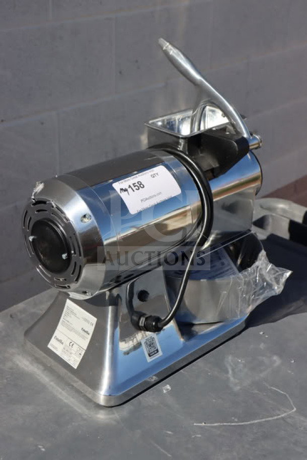 Brand new Estella CG112NB electric hard cheese grater, 1 1/2 hp, 3.3 lb/min, 110V, with labels indicating model and serial number.